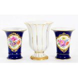 ONE AND A PAIR OF MEISSEN VASES, THE PAIR PAINTED WITH FLOWERS RESERVED ON A BLUE GROUND 14CM H,