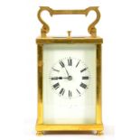 A FRENCH CARRIAGE CLOCK WITH PRIMROSE ENAMEL DIAL AND GONG STRIKING MOVEMENT, REPEAT BUTTON IN THE