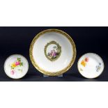 A VIENNA SAUCER, PAINTED WITH AN OVAL MEDALLION OF TWO CHILDREN IN GREEN AND GILT BORDER, 13CM DIAM,