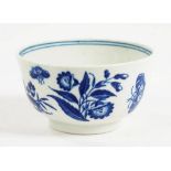 A WORCESTER BLUE AND WHITE TEA BOWL TRANSFER PRINTED WITH THE THREE FLOWERS PATTERN 7.5CM DIAM