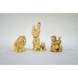 Three late 19th century Japanese carved ivory okimono's of a boy with a toad, 3.