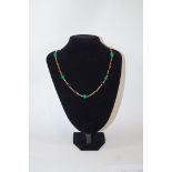 A 9 carat gold and green agate bead necklace,