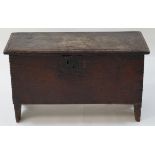 A 17th century style oak coffer of small proportions with strap hinges, 44cm high, 72.