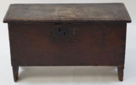A 17th century style oak coffer of small proportions with strap hinges, 44cm high, 72.