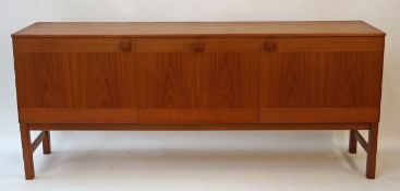 A 1960s teak sideboard with three doors on square legs, 74cm high, 179cm wide, 43.