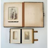 A Victorian leather and brass bound photograph album with various family portraits and one other
