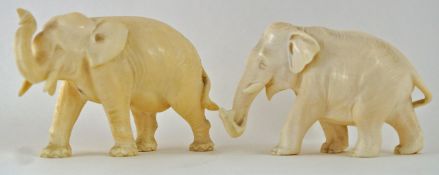 Two late 19th century Japanese carved ivory figures of elephants,