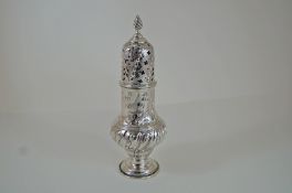 A Victorian silver caster, by Daniel & John Welby, London 1887, of embossed baluster form,