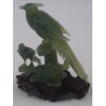 A 20th century Chinese carved hard stone figure of two birds of paradise,