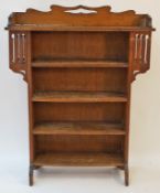 An oak Arts and Crafts bookcase, applied label to the reverse "P. E.