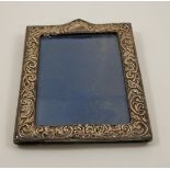 A silver photograph frame, Birmingham 1903, of rectangular outline, 18 cm high, image area 13.