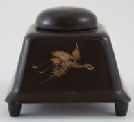 An early 20th century lacquer inkwell, decorated in gilt with flying insects, a crane and a tree,