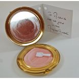 A House of Commons Stratton powder compact, together with a signed card by Margaret Thatcher,