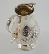 A silver cream jug, by Frazer & Haws, London 1870, of baluster sparrow beak form,