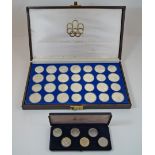 A boxed set of twenty eight Canadian Olympic commemorative coins 1976 and a boxed set of six