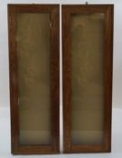 A pair of oak shop hanging display cabinets, each with a hinged glazed door, 120cm high, 39.