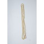 A graduated row of simulated pearls, to a barrel clasp,