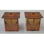 A pair of Art Deco style lamp shades with copper effect frames and tinted, frosted glass panels,