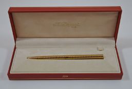 S T Dupont gold coloured ring pattern ball pen,