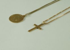 A 9 carat gold St Christopher pendant; with a 9 carat gold cross pendant;