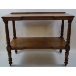 A 19th century oak two tier buffet on turned supports on casters, 96cm high, 119cm wide, 61.