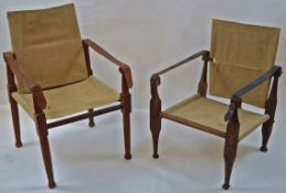 Two early 20th century Colonial chairs with canvas backs and seats,