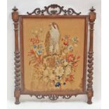 A Victorian  fire screen with woolwork tapestry of a hawk and foliage, 103cm high, 81.