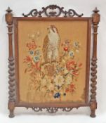 A Victorian  fire screen with woolwork tapestry of a hawk and foliage, 103cm high, 81.