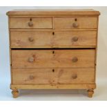 A Victorian pine chest of two short and three long drawers, with turned handles and turned legs,