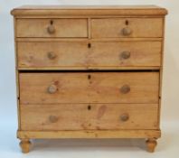 A Victorian pine chest of two short and three long drawers, with turned handles and turned legs,