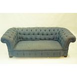 A Victorian button back sofa, upholstered in blue, 71cm high,