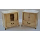 A pair of painted and metal mounted bedside cabinets,