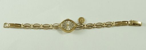 A lady's Rotary 9ct gold bracelet watch, with a small Saint Christopher pendant attached, 8.