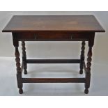 An oak side table with one frieze drawer linked by stretchers, 75cm high, 94cm wide,