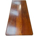 A large mahogany dining table with triple plank top and Victorian turned legs with ceramic casters,