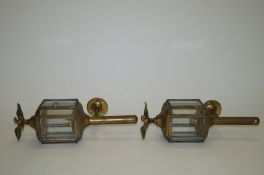A pair of brass carriage style lamps, each with eagle finial, 36.