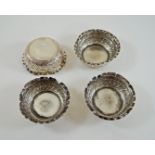 Set of four silver salts, of circular outline with embossed decoration, London 1890,