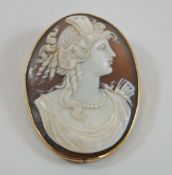 A Victorian shell cameo brooch, carved with a classical female profile, 4.