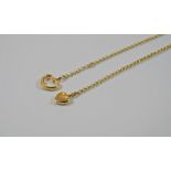 A gold chain with two heart pendants, marked 14K, 5.