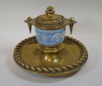 A Victorian brass inkwell incorporating a Wedgwood jasperware bowl moulded with classical motifs,