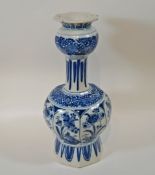 A 19th century Delft vase, painted in blue with birds and flowers in panels,