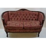 A two seat sofa and two armchairs, with carved mahogany show frame,