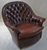 A leather button back tub chair, with one loose cushion on casters, 81.
