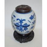 A 19th century Chinese porcelain ginger jar painted in blue with various objects, 24cm high,