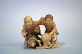 A late 19th century Japanese carved ivory okimono of two figures, a monkey and an octopus, 4.