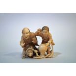 A late 19th century Japanese carved ivory okimono of two figures, a monkey and an octopus, 4.