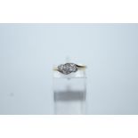 A three stone diamond 9 carat gold ring,