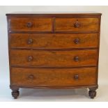 A Victorian mahogany bowfronted chest of two short and three long drawers with turned handles on