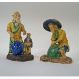 Two Chinese mudman figures, one of a fisherman with lobster pot, 11cm high,