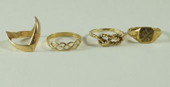 A 9 carat gold wishbone ring; with a 9 carat gold signet ring; and two other rings; 8.